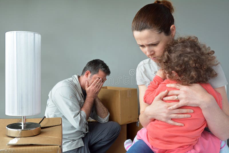 Sad evicted family worried relocating house.