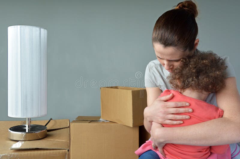 Sad evicted mother with child worried relocating house