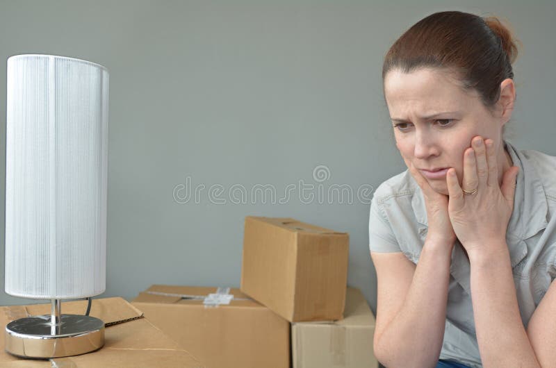 Sad evicted woman worried relocating house