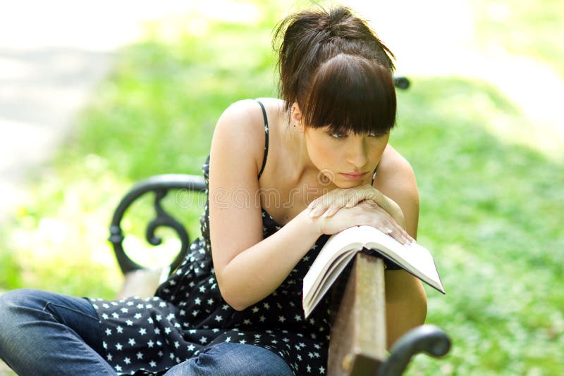 Sad girl with book