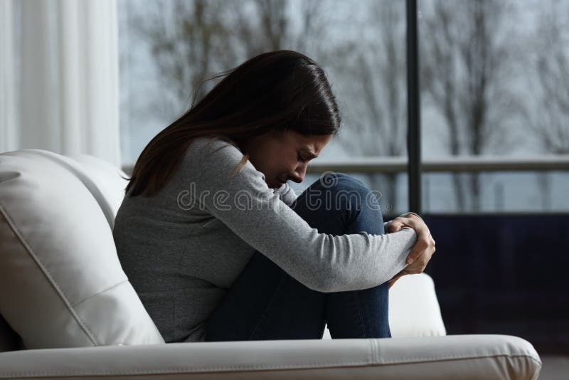 Sad girl crying and complaining alone at home royalty free stock image Sad girl crying and complaining alone at home royalty free stock image