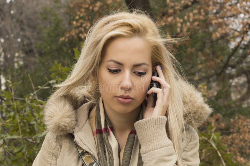 Sad Girl Talking On Mobile Phone royalty free stock images Sad Girl Talking On Mobile Phone royalty free stock images