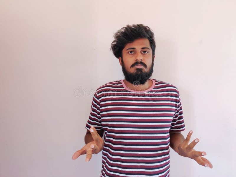 Sad Indian beard man, showing helpless gesture with arm and hands, mouth curved as if he does not know what to do. Isolated on royalty free stock images Sad Indian beard man, showing helpless gesture with arm and hands, mouth curved as if he does not know what to do. Isolated on royalty free stock images