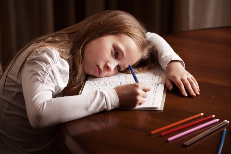 little girl crying doing homework