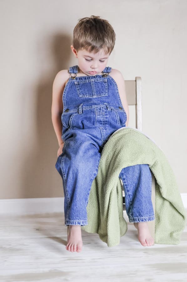 Sad little boy stock image. Image of coveralls, male - 38326253