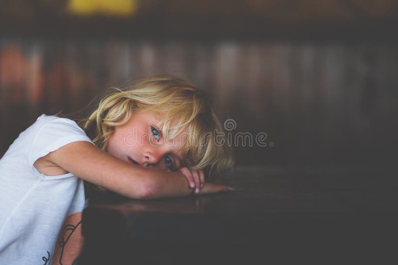 Portrait of a sad blue eyed blond little girl. Portrait of a sad blue eyed blond little girl