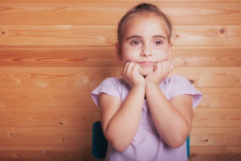 Premium Photo  Child girl sad profile face close up with hands on cheek.