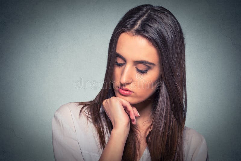 Sad lonely young woman looking down stock photography Sad lonely young woman looking down stock photography