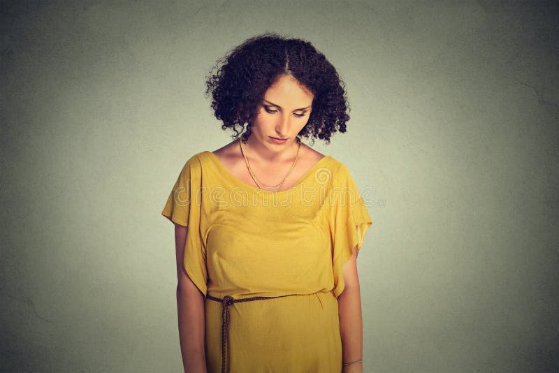Sad lonely young woman looking down stock photography Sad lonely young woman looking down stock photography