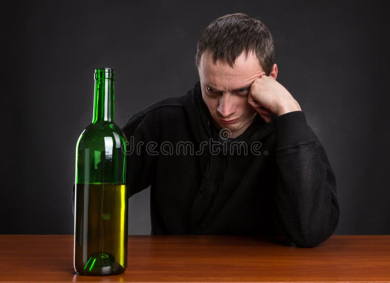 Sad Man Looks at the Bottle Stock Image Image of grief, hangover