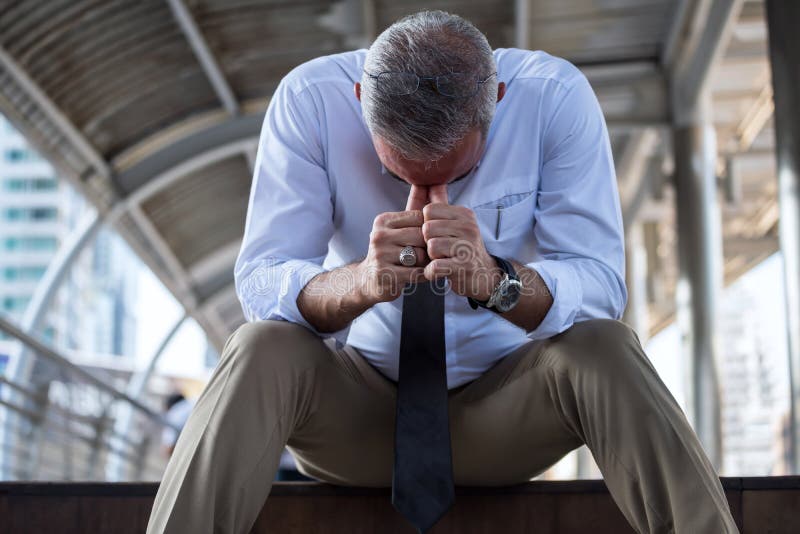 Sad old businessman get fired in city. Stressed American old businessman head down and sit on stair in depressed feeling mood after failed in business and stock images Sad old businessman get fired in city. Stressed American old businessman head down and sit on stair in depressed feeling mood after failed in business and stock images