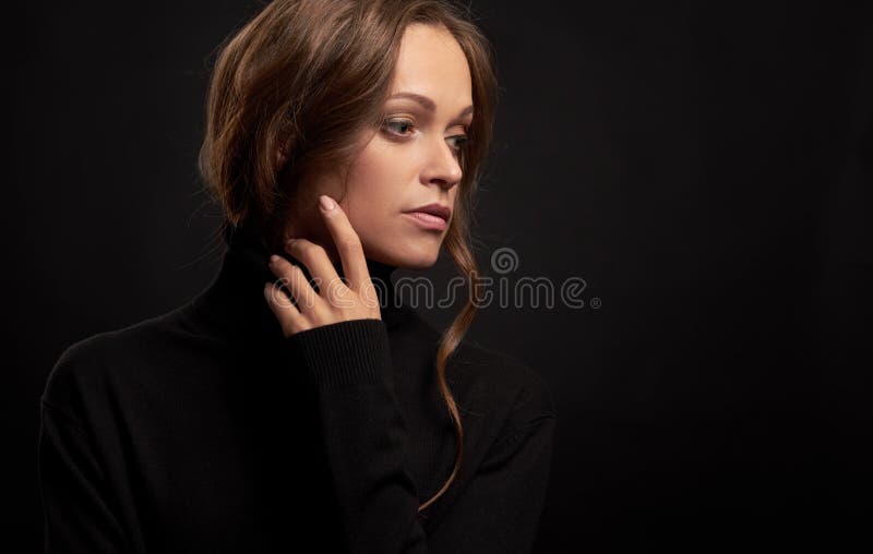 Sad pretty woman looking away wearing turtleneck