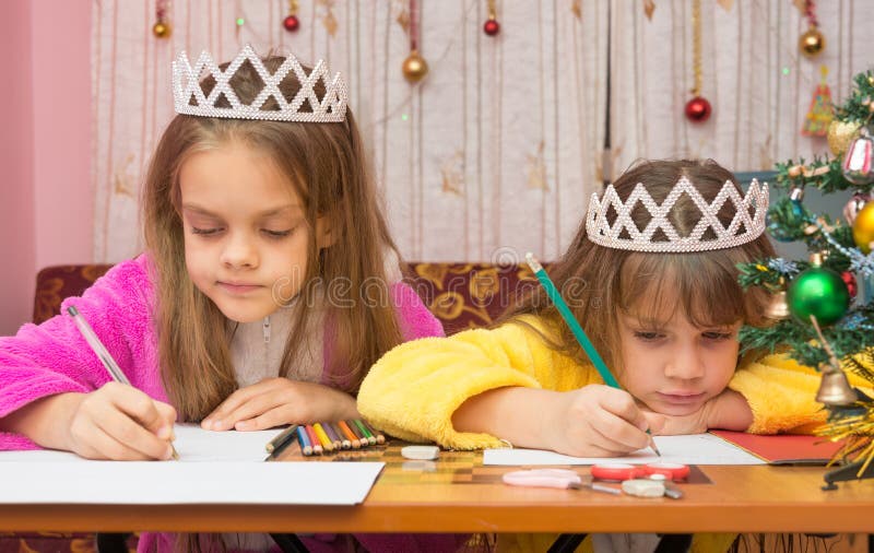Sad Sisters write letter to Santa Claus royalty free stock images Sad Sisters write letter to Santa Claus royalty free stock images
