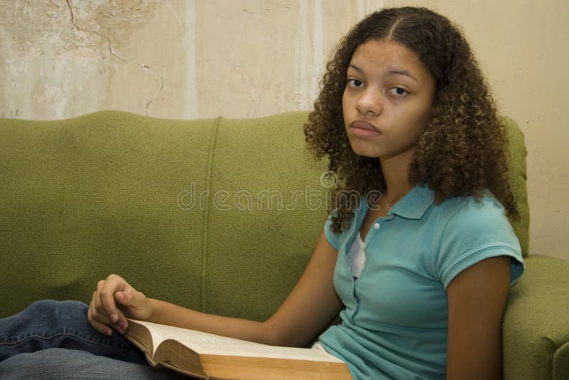 Sad Teenager with Book in Apartment