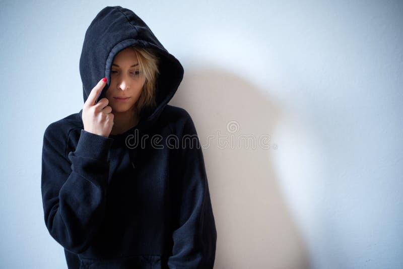girl hiding in hoodie