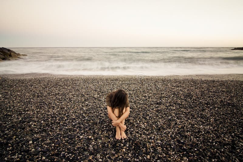 Sad woman on the beach
