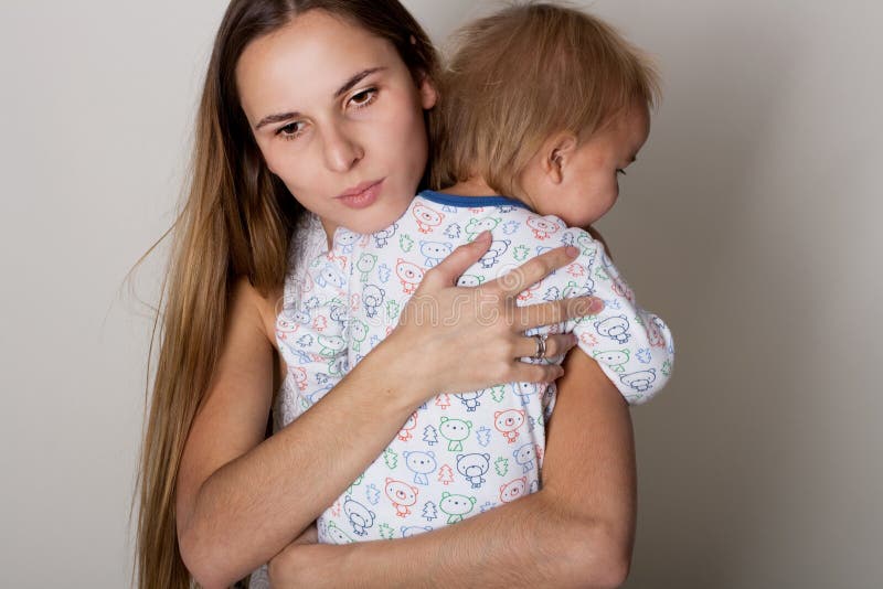 Sad woman with little boy