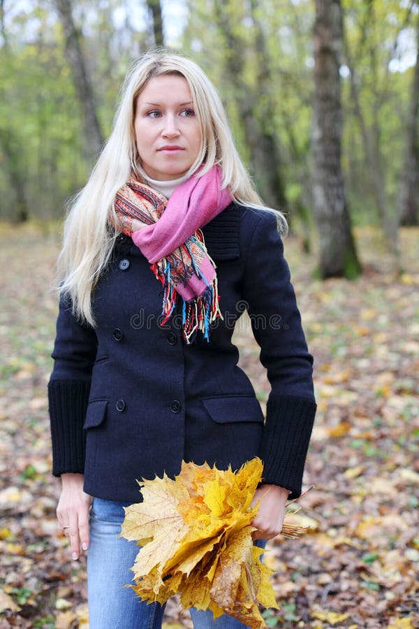 Sad woman with maple leaflets