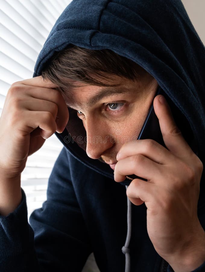 Sad Young Man with a Phone royalty free stock photography
