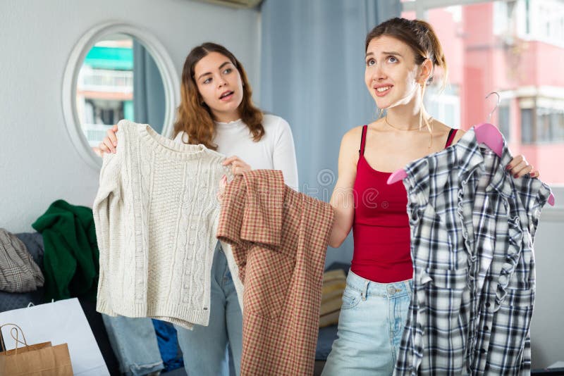 Sad Young Woman Choosing Clothes To Wear Stock Image - Image of ...
