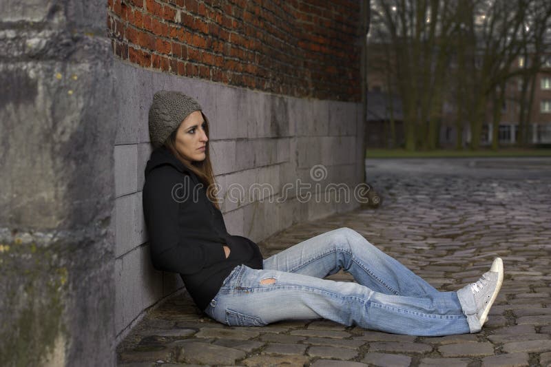 Sad young woman with knitted hat