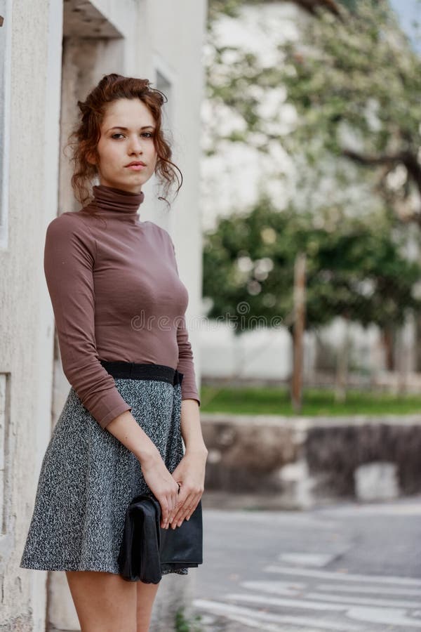 Sad Young Woman Standing Waiting at the Side of the Street Stock Photo ...