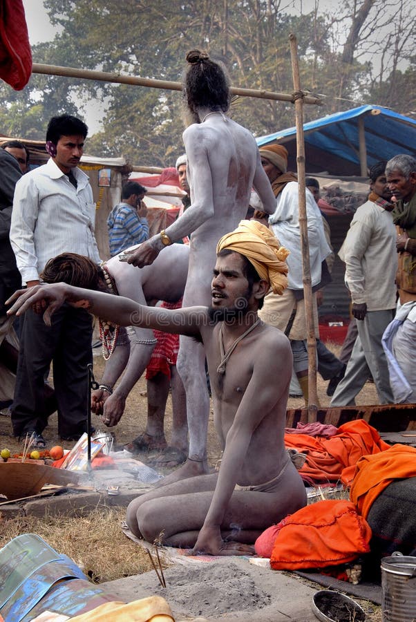 January 13, 2011-Ganga sagar, West Bengal, India –During the fair, in the ascetics stall-people are visit to those saint’s for their expectation and saints earn much money in this process. Gangasagar Mela is the largest fair, celebrated in West Bengal (INDIA). This fair is held where the Ganga river and the Bay of Bengal form a nexus. Hence the name Gangasagar Mela. January 13, 2011-Ganga sagar, West Bengal, India –During the fair, in the ascetics stall-people are visit to those saint’s for their expectation and saints earn much money in this process. Gangasagar Mela is the largest fair, celebrated in West Bengal (INDIA). This fair is held where the Ganga river and the Bay of Bengal form a nexus. Hence the name Gangasagar Mela.