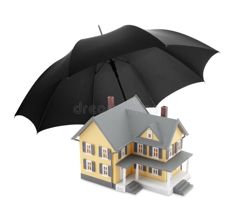 Small yellow model house and black umbrella over white background. Small yellow model house and black umbrella over white background