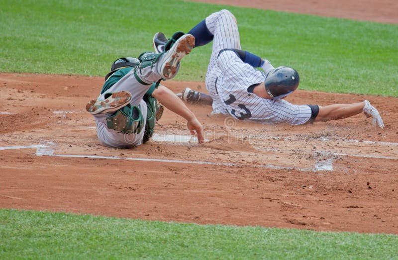 Alex Rodriguez of baseball's New York Yankees slides safely past the Oakland Athletics catcher in a close play at home plate. Alex Rodriguez of baseball's New York Yankees slides safely past the Oakland Athletics catcher in a close play at home plate.