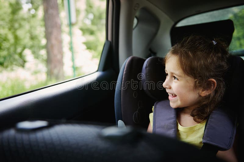 https://thumbs.dreamstime.com/b/safe-movement-children-car-adorable-baby-girl-enjoys-travel-looks-out-opened-window-sitting-safety-booster-221996572.jpg