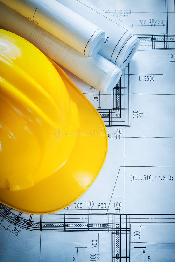 Safety Building Helmet Construction Drawings on Blueprint Stock Image