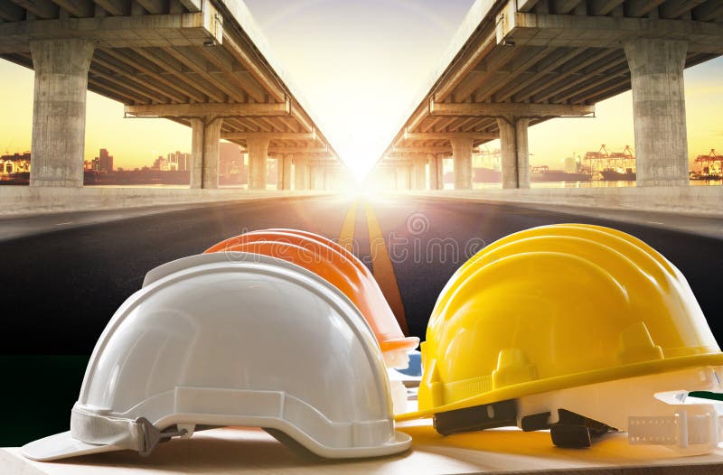 Safety Helmet On Civil Engineering Working Table Against 