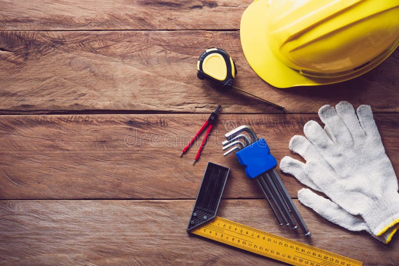 Safety helmet with safety equipment for work on wooden floor. royalty free stock image Safety helmet with safety equipment for work on wooden floor. royalty free stock image