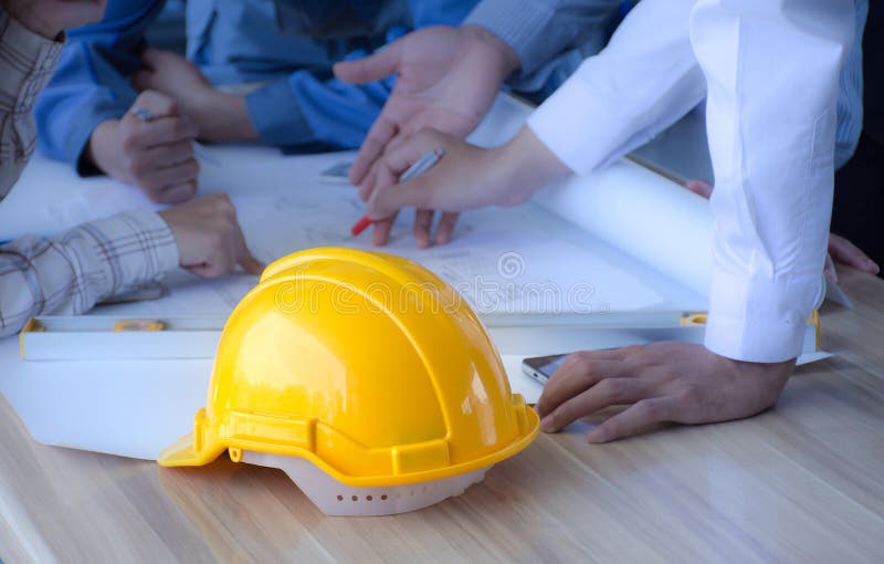 Safety helmet placed on a meeting table engineering team. ,Engineering concept. royalty free stock images Safety helmet placed on a meeting table engineering team. ,Engineering concept. royalty free stock images