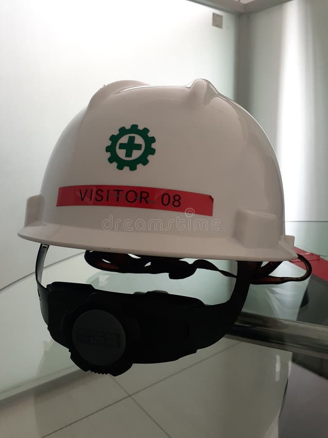Safety helmet for visitor stock image. Image of site 197957403
