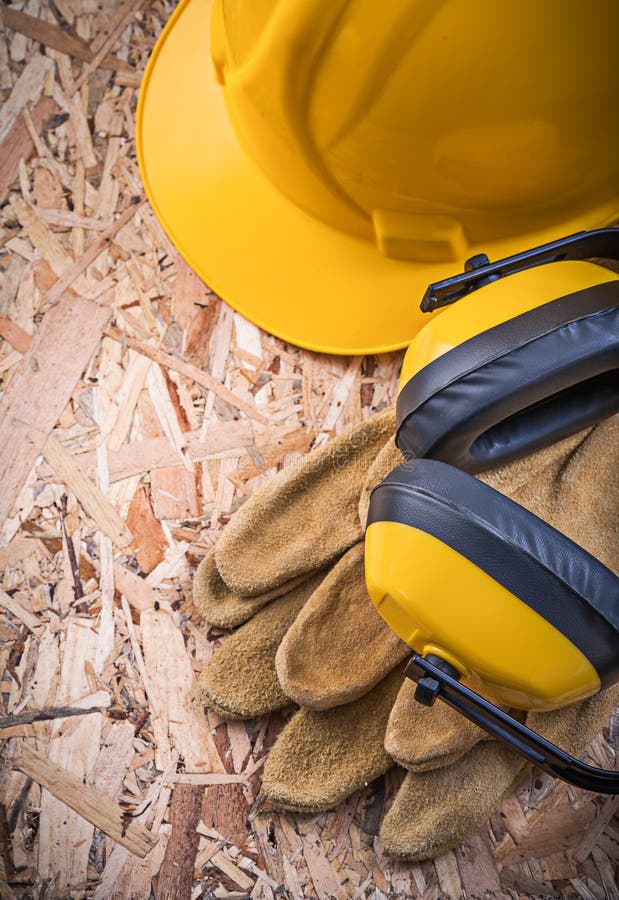 Safety Leather Gloves Hard Hat Earmuffs on OSB Stock Image Image of