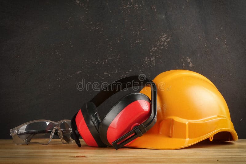 Safety Personal Protective EquipmentPPE on a rustic black background. royalty free stock photos