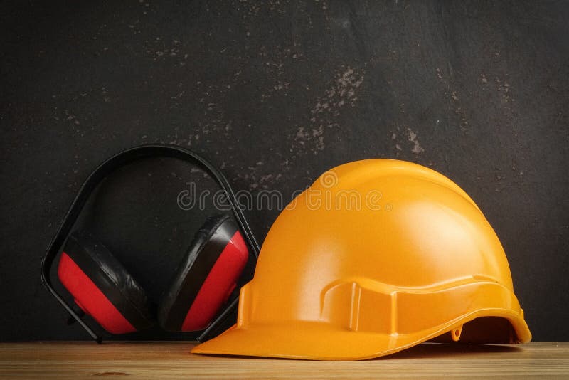 Safety Personal Protective EquipmentPPE on a rustic black background. royalty free stock image