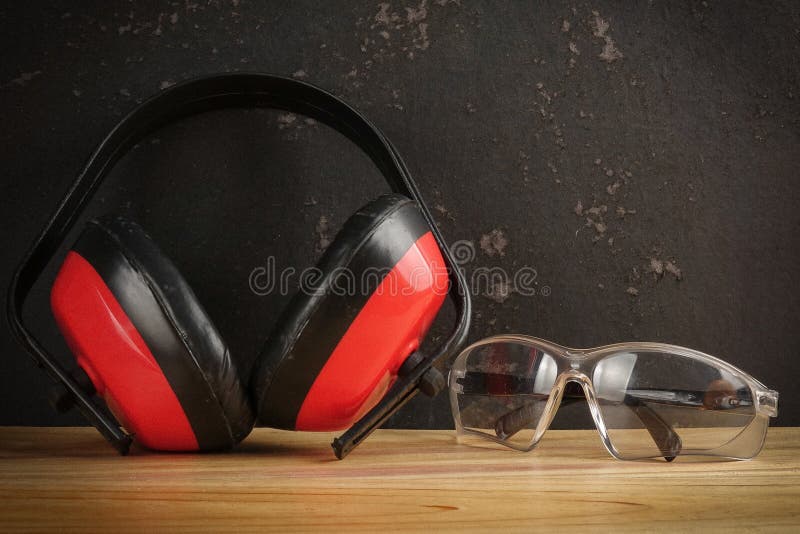 Safety Personal Protective EquipmentPPE on a rustic black background. stock photography