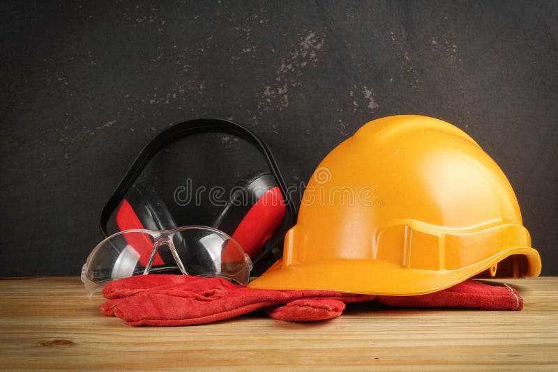 Safety Personal Protective EquipmentPPE on a rustic black background. royalty free stock image