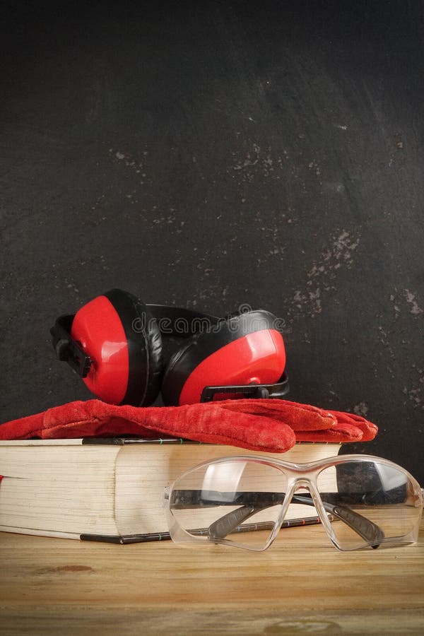 Safety Personal Protective EquipmentPPE on a rustic black background. royalty free stock photography