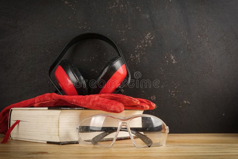 Safety Personal Protective EquipmentPPE on a rustic black background. royalty free stock photography