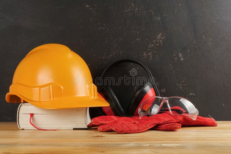 Safety Personal Protective EquipmentPPE on a rustic black background. royalty free stock image