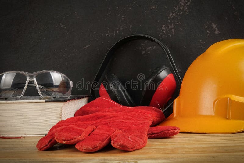 Safety Personal Protective EquipmentPPE on a rustic black background. stock photo