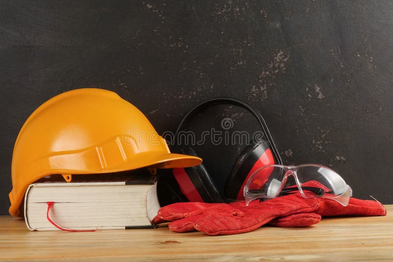 Safety Personal Protective EquipmentPPE on a rustic black background. stock photography