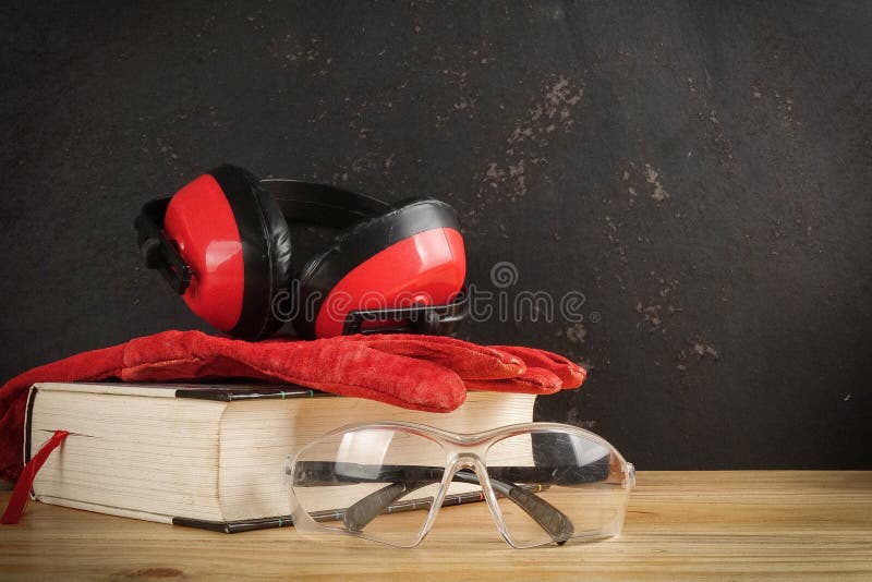 Safety Personal Protective EquipmentPPE on a rustic black background. royalty free stock image