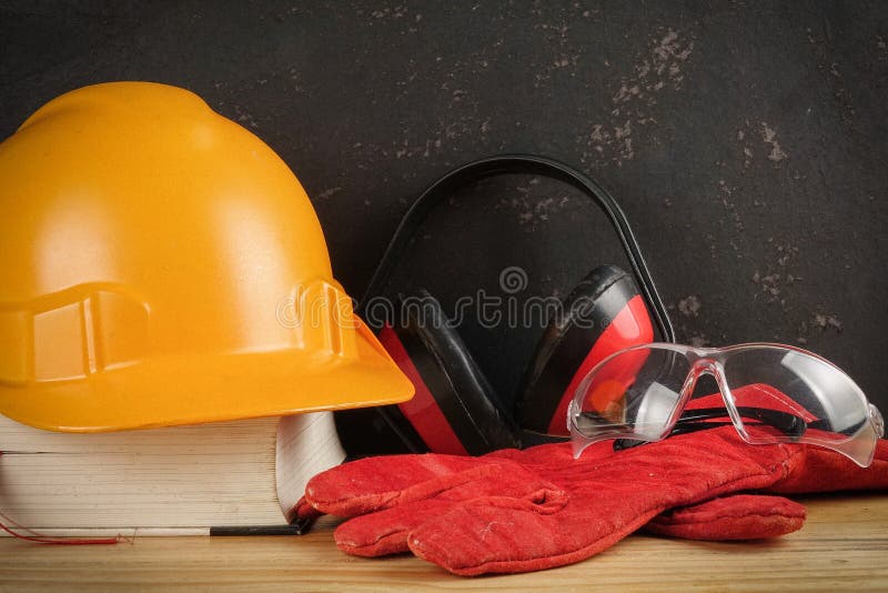 Safety Personal Protective EquipmentPPE on a rustic black background. stock photo