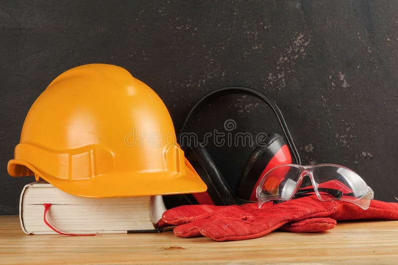 Safety Personal Protective EquipmentPPE on a rustic black background. stock image