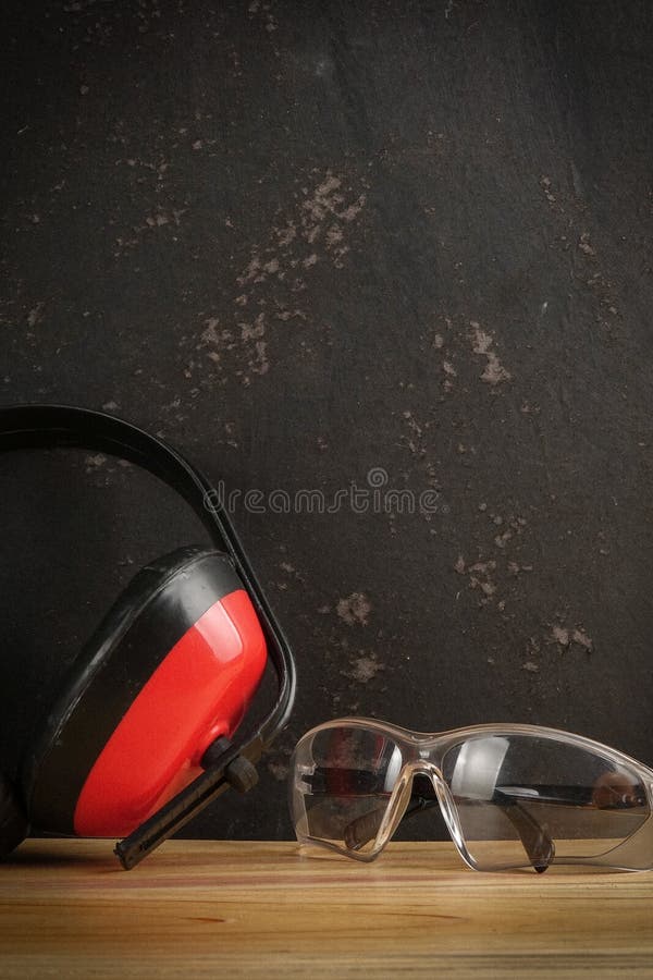 Safety Personal Protective EquipmentPPE on a rustic black background. royalty free stock photography