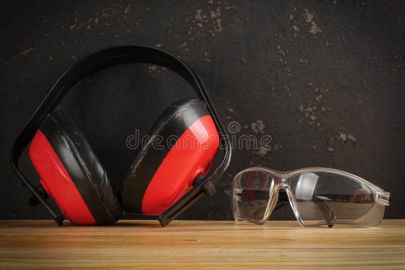 Safety Personal Protective EquipmentPPE on a rustic black background. stock photography
